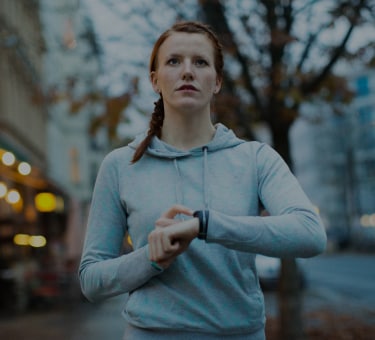  Sporty woman checking smartwatch