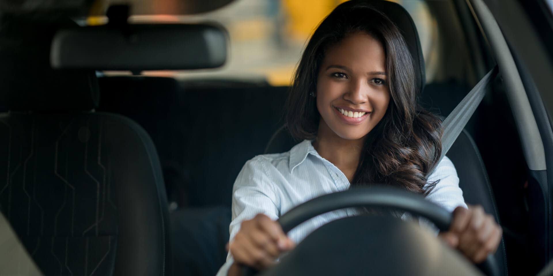 Smiling woman driving