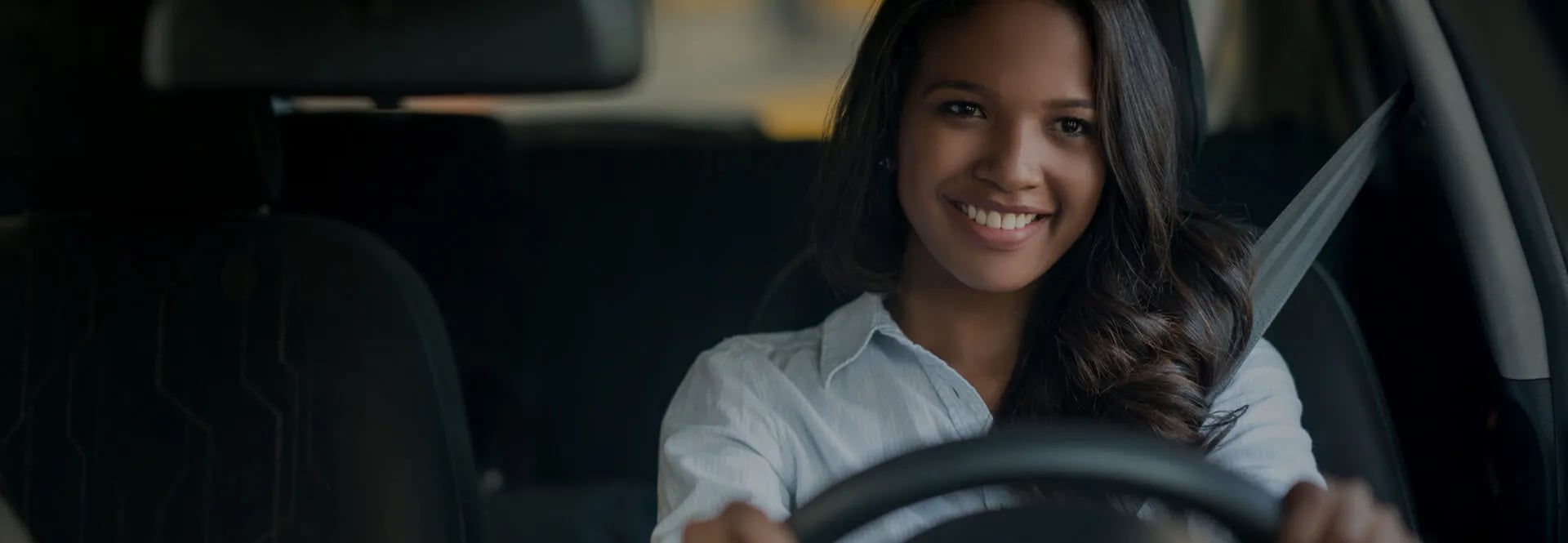 smiling woman driving