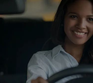 smiling woman driving