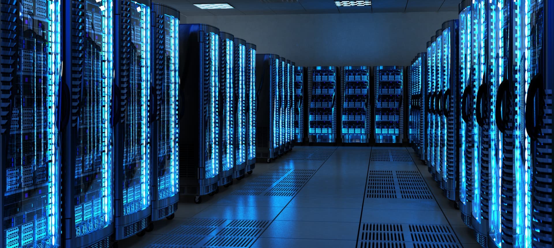 Server racks with illuminated equipment inside a modern data center