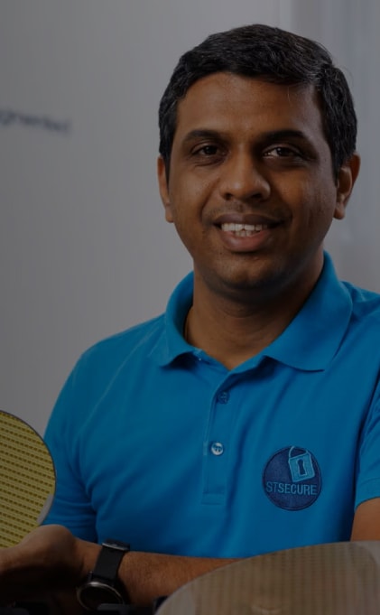 Man holding a wafer from ST Microelectronics 