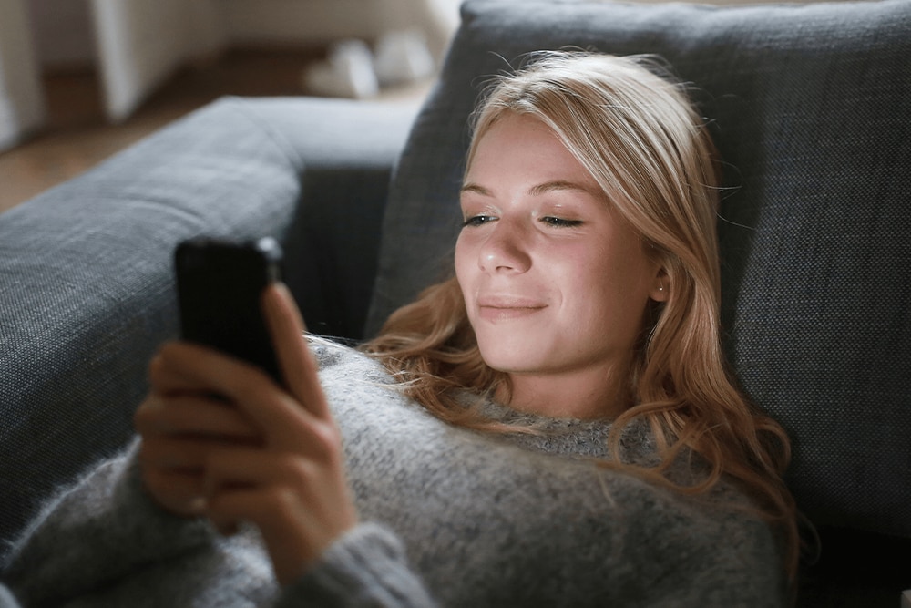 Image of a person holding a smartphone