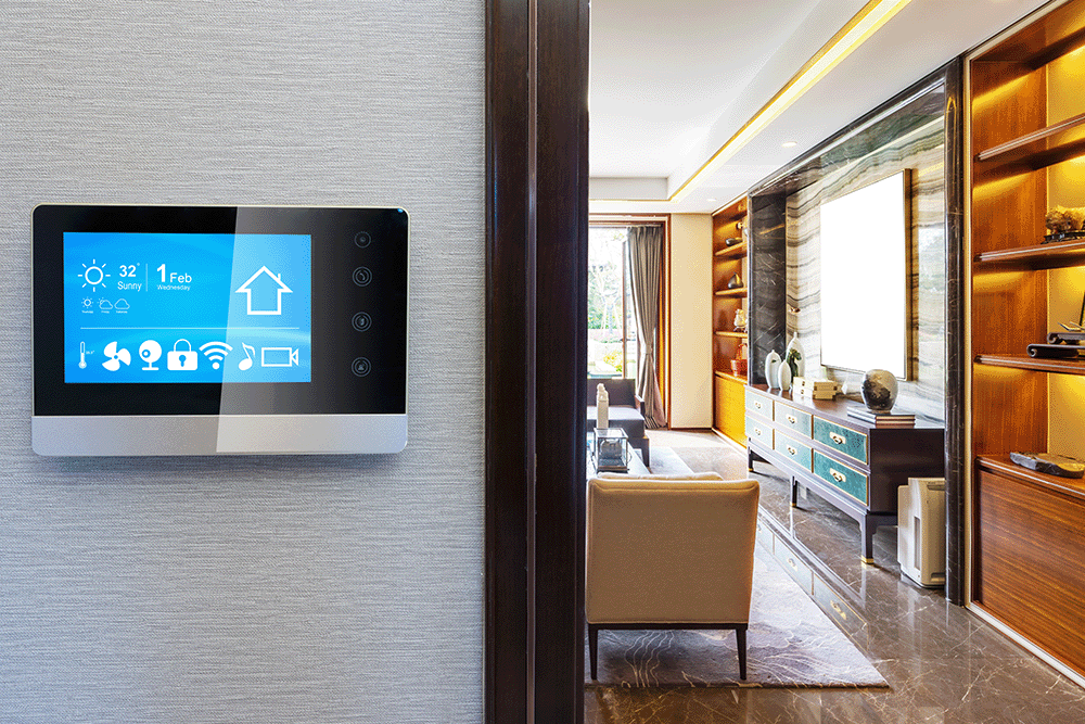 Smart home control panel mounted on a wall next to a modern living room. 