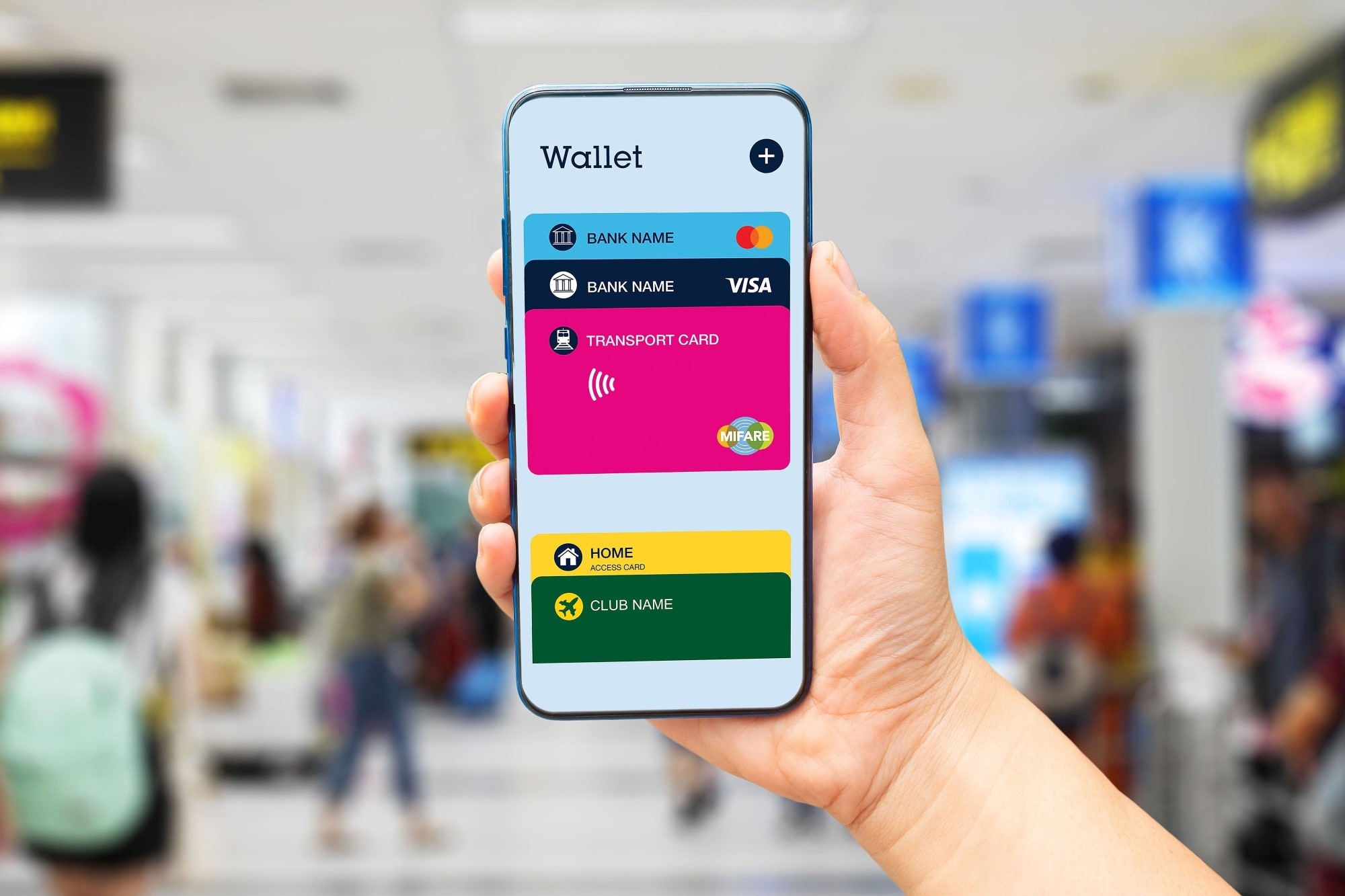 A hand holding a smartphone displaying a colorful mobile app interface, with a busy indoor public space in the background. 