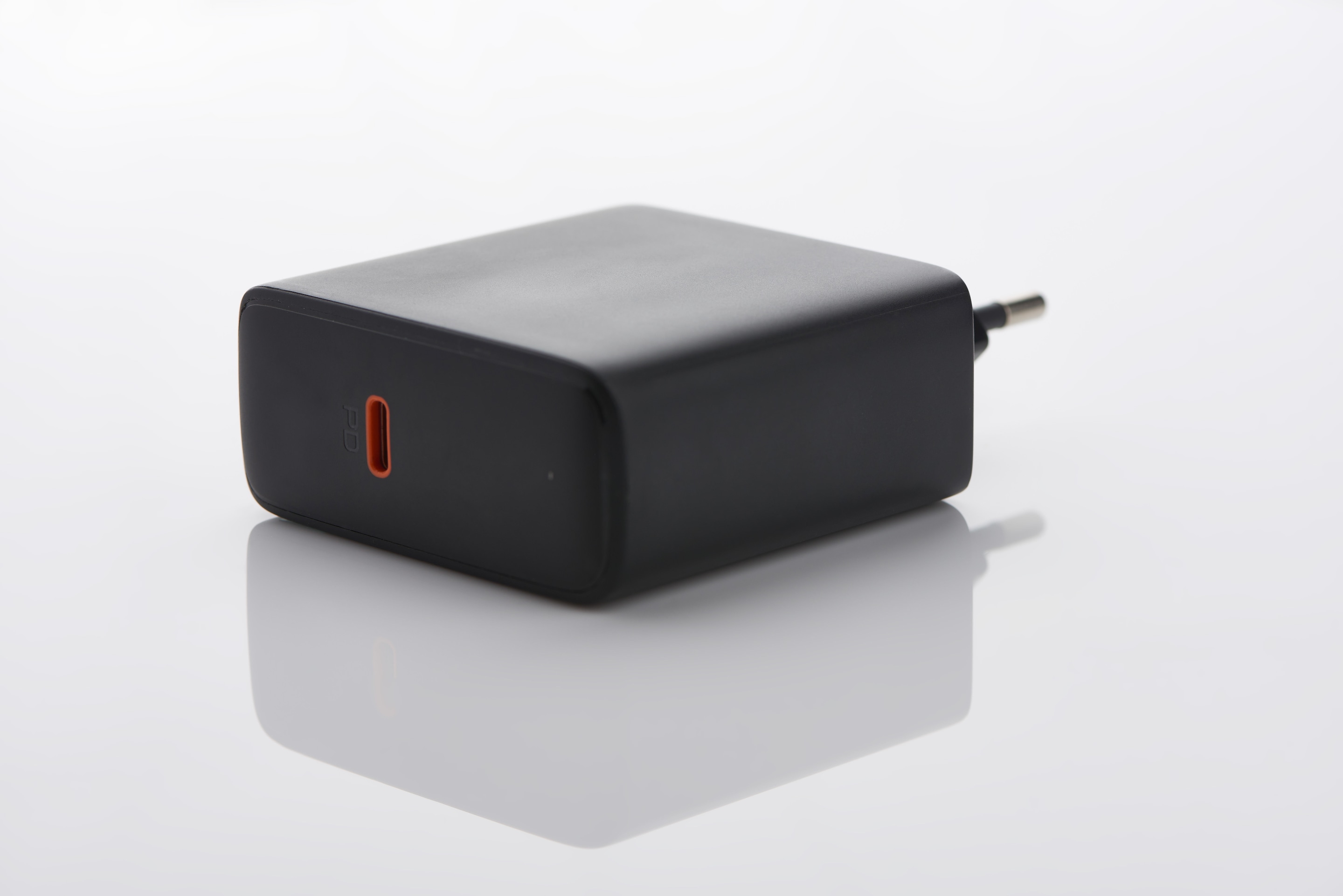 Black USB-C wall charger with a single port