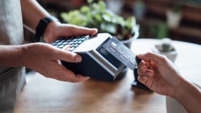 someone opening a door with a biometric smart card 